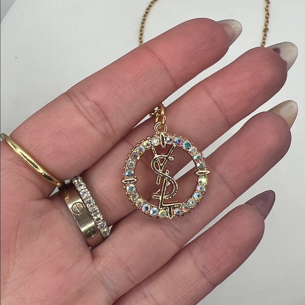 868. Elegant Gold YSL Pendant on 18” gold plated chain. - Picture 3 of 8